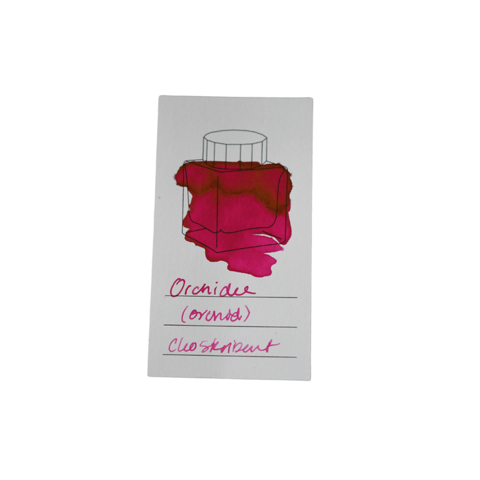 Cleo Skribent bottled fountain pen ink in Orchidee (orchid) color, with a clear glass ink bottle showing vibrant purple ink.