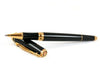 Cleo Skribent Skribent Gold black rollerball pen with gold accents, sleek and stylish writing instrument.