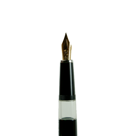 Open Cleo Skribent Classic Gold fountain pen with black body and silver accents, showing the gold nib and piston mechanism.