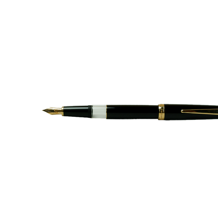 Cleo Skribent Classic Gold fountain pen with black barrel and gold accents, open to reveal the nib and piston filling mechanism.