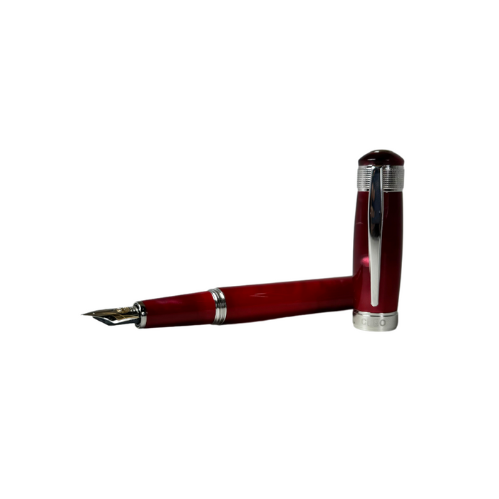 Cleo Skribent Aura red fountain pen with gold accents, showcasing sleek design and detailed nib for smooth writing.