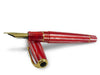 Conway Stewart Series 100 Red Candy Spaghetti fountain pen with gold accents and fine nib, showcased on a white background.