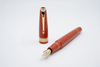 Conway Stewart Orange Duofold fountain pen with fine nib, featuring a sleek orange barrel and elegant design.