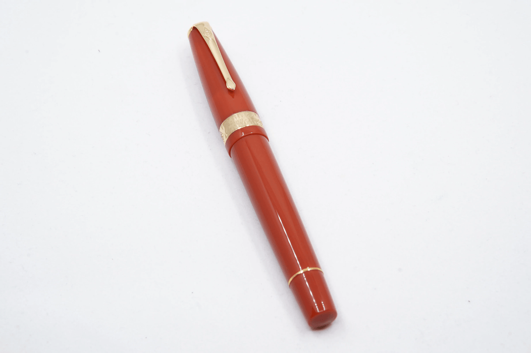 Conway Stewart Orange Duofold fountain pen with fine nib, featuring a sleek orange body and elegant design.
