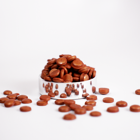 Copper-colored Papier Plume wax beads for candle making, small round wax beads in a natural copper hue.