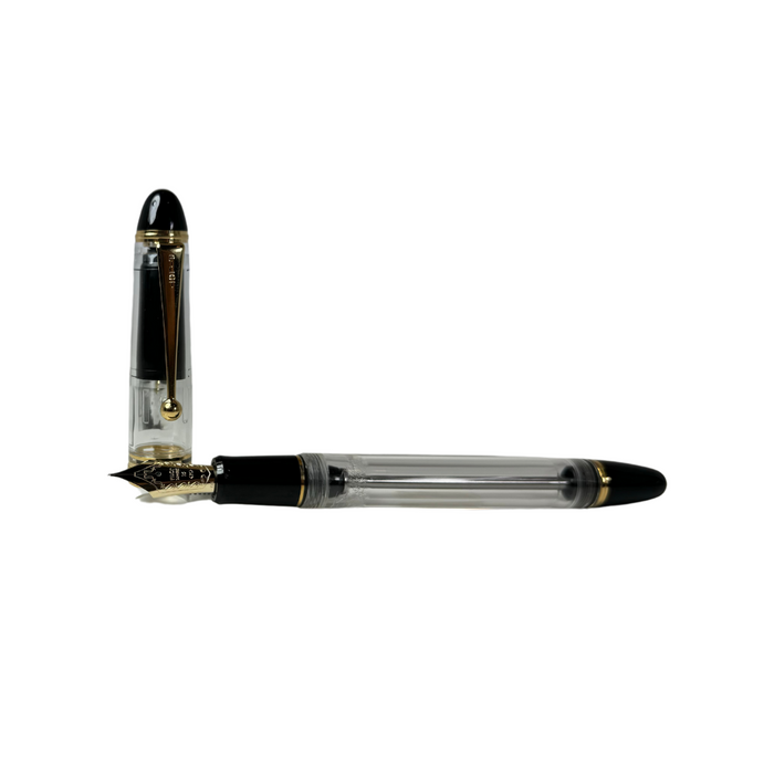 Pilot Custom 823 fountain pen with clear resin barrel and gold accents, showcasing elegant design and fine writing instrument features.