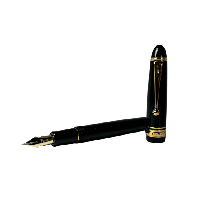 Pilot Custom 743 black fountain pen with gold accents, showcasing its sleek design and fine nib.