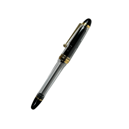Pilot Custom 823 clear fountain pen with translucent body and gold accents, showcasing its elegant design and craftsmanship.