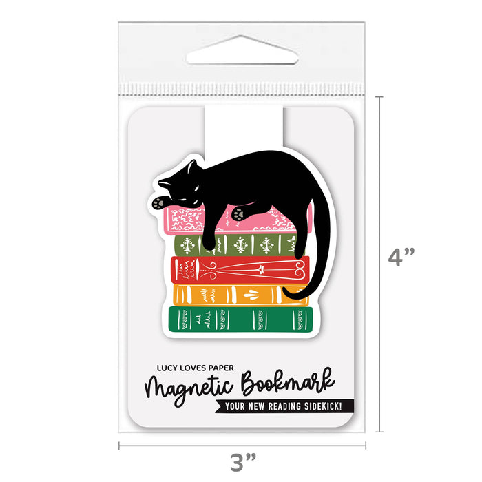Magnetic cat bookmark attached to a book page, featuring a cute cat design by Lucy Loves Paper for book lovers.