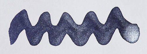 Diamine Shimmertastic Arabian Nights shimmering fountain pen ink in a glass bottle with vibrant dark blue and gold shimmer details.
