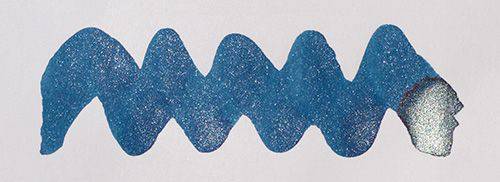 Diamine Shimmertastic Starlit Sea shimmering fountain pen ink in a glass bottle showing vibrant blue ink with shimmer particles.