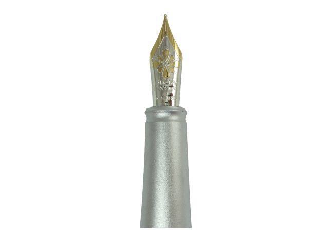 Red Diplomat Aero fountain pen with an elegant design and fine nib, showcasing its sleek body and cap.