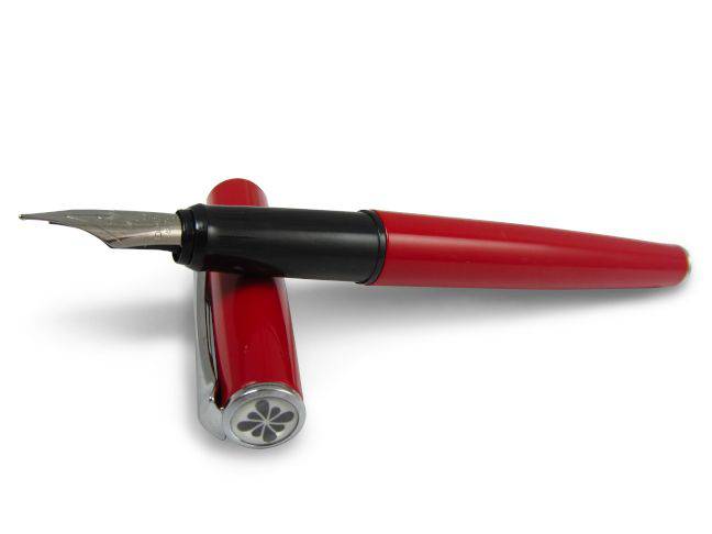 Elegant Diplomat Esteem red lacquer fountain pen with gold accents, showcasing a fine nib and sleek design.