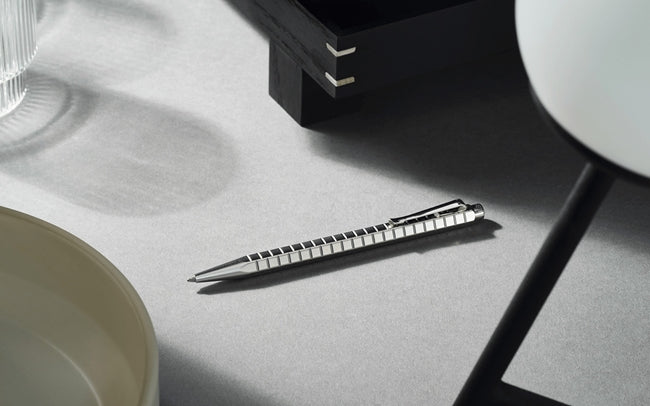Caran D'Ache Platinum-Coated ECRIDOR AVENUE rollerball pen with detailed close-up of the gold finish and elegant design.