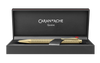 Caran D'Ache Gilded Ecridor Chevron ballpoint pen with gold accents and detailed chevron pattern, close-up view