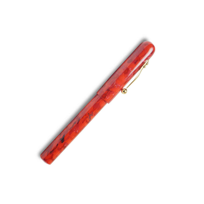 Matthieu Faivet Mémento Rouge fountain pen with Jowo steel nib and gold finish, showcasing elegant design and fine craftsmanship.