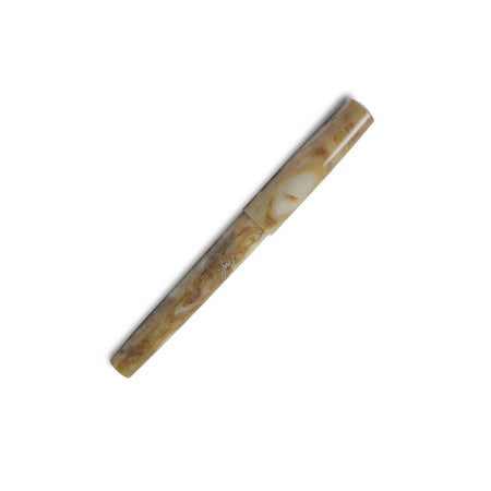 Faivet Number 7 Lucite marble resin fountain pen with steel nib, featuring a sleek design and fine point.