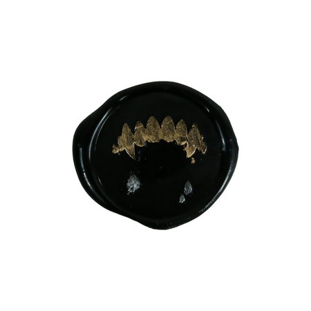 Wax seal featuring fang design by Papier Plume, showcasing intricate fang-shaped motif on a classic wax seal.