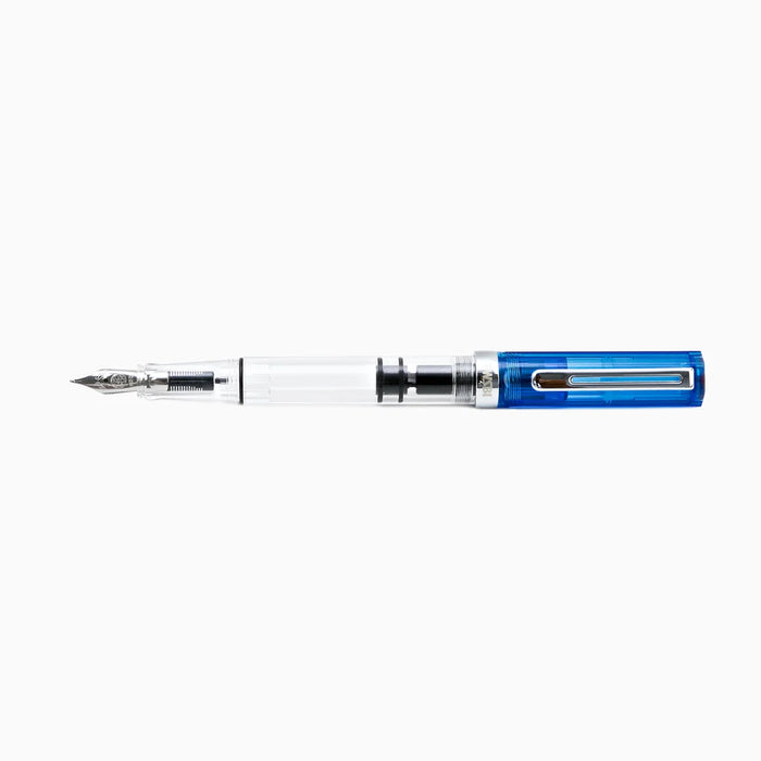 Twsbi Eco transparent blue fountain pen with silver clip and grip section, showcasing its sleek design and clear blue barrel.