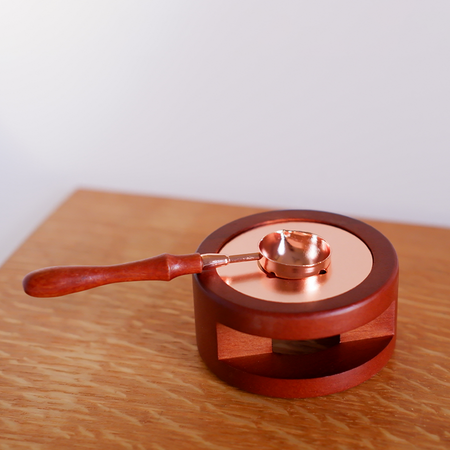 Rose gold Papier Plume sealing wax melting furnace used for melting and pouring sealing wax.