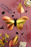 Large yellow silk butterfly craft by Assembli, featuring intricate paper and fabric details for DIY projects and decorations.
