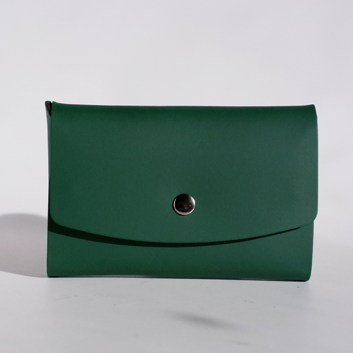 Green Papier Plume Swatch Card Holder made of regenerated leather, designed for storing and organizing fabric or swatch cards.