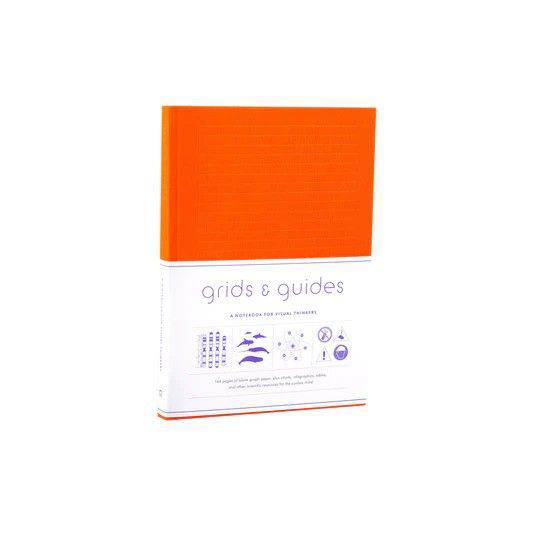 Large orange Grid & Guides journal by Princeton Architectural Press with grid pages for sketches and note-taking.