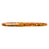 Esterbrook Estie fountain pen with gold fittings, displayed on honeycomb-patterned background, showcasing elegant design and craftsmanship.