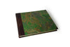 Large handcrafted guest book with dark blue marbleized cover and leather trim, ideal for special events and guest signatures.