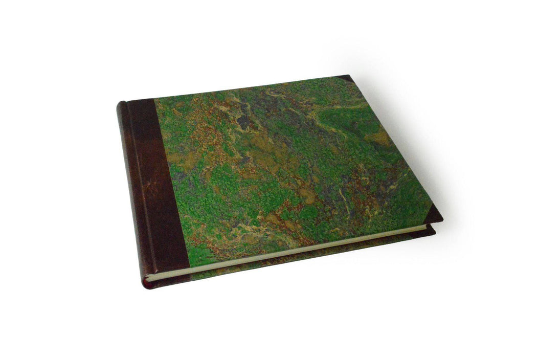 Large handcrafted guest book with dark blue marbleized cover and leather trim, ideal for special events and guest signatures.