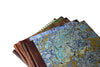 Large handcrafted guest book by Il Cartiglio with a marbleized cover and leather trim, perfect for special occasions.