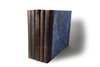 Small handcrafted guest book by Il Cartiglio with dark green marbleized cover and leather trim, ideal for special occasions.