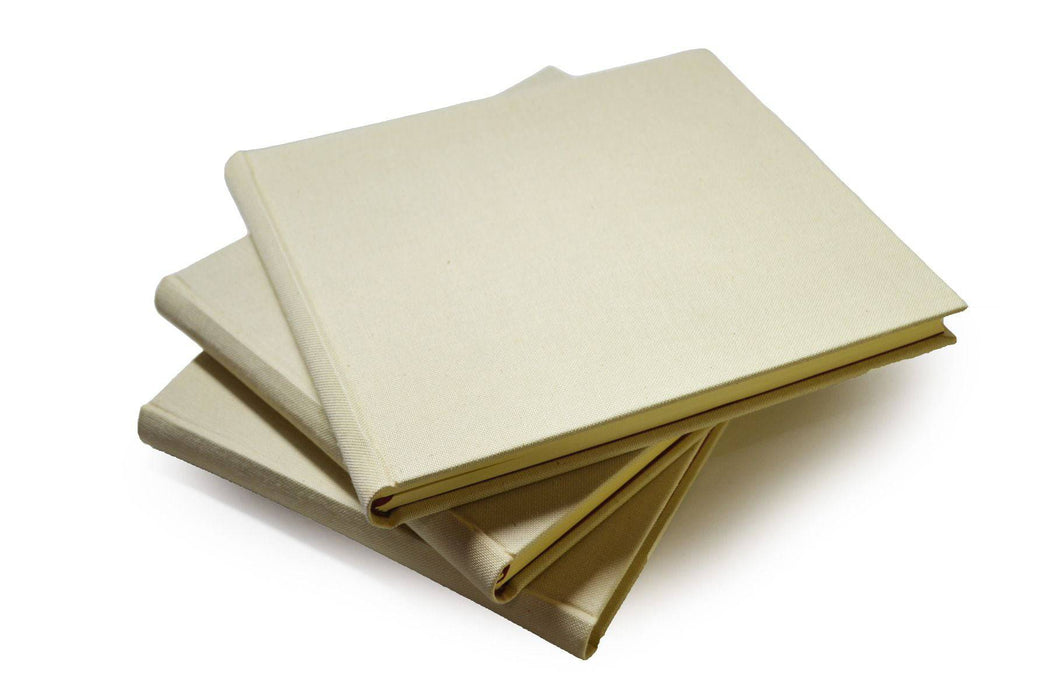 Large handcrafted Off-White Linen Guest Book by Il Cartiglio, featuring elegant, textured fabric cover for guest signatures and keepsakes.