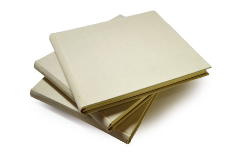Large handcrafted Off-White Linen Guest Book by Il Cartiglio, featuring elegant, textured fabric cover for guest signatures and keepsakes.