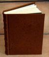 Leather-bound sketching journal by Il Cartiglio with a hard cover, ideal for drawing and note-taking.