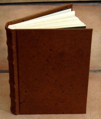Leather-bound sketching journal by Il Cartiglio with a hard cover, ideal for drawing and note-taking.