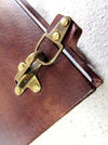Leather bound Il Cartiglio sketching journal with hard cover and buckle closure, featuring a classic leather design and durable construction.