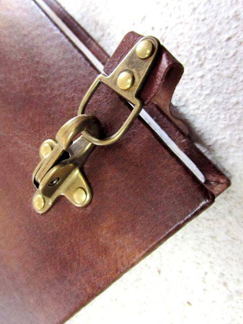 Leather bound Il Cartiglio sketching journal with hard cover and buckle closure, featuring a classic leather design and durable construction.