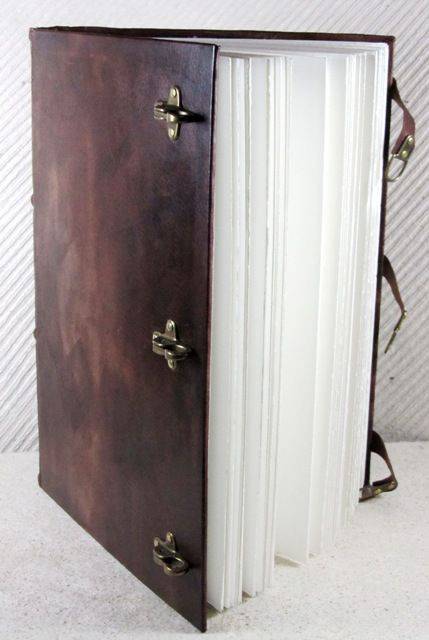 Leather bound Il Cartiglio sketching journal with a hard cover and buckle closure for durable, stylish note-taking and drawing.