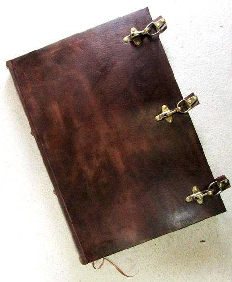 Leather bound Buckled Sketching Journal by Il Cartiglio with hard cover and leather exterior for sketching and note-taking.