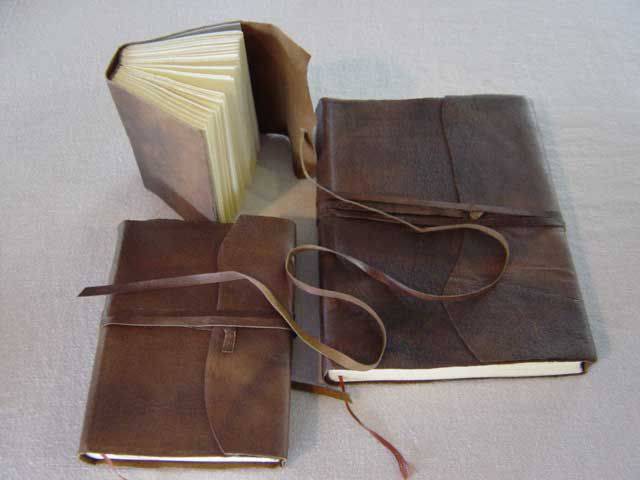 Softcover leather sketching journal with wraparound strap by Il Cartiglio, featuring a compact design and smooth leather cover.