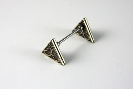 Bortoletti triangle pen rest in white ceramic with gold accents, designed to hold pens elegantly on a desk.