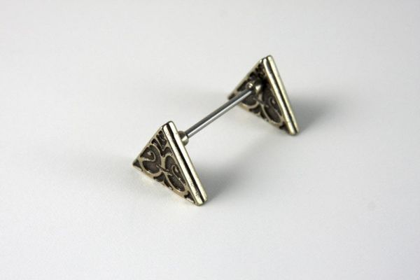 Bortoletti triangle pen rest in white ceramic with gold accents, designed to hold pens elegantly on a desk.