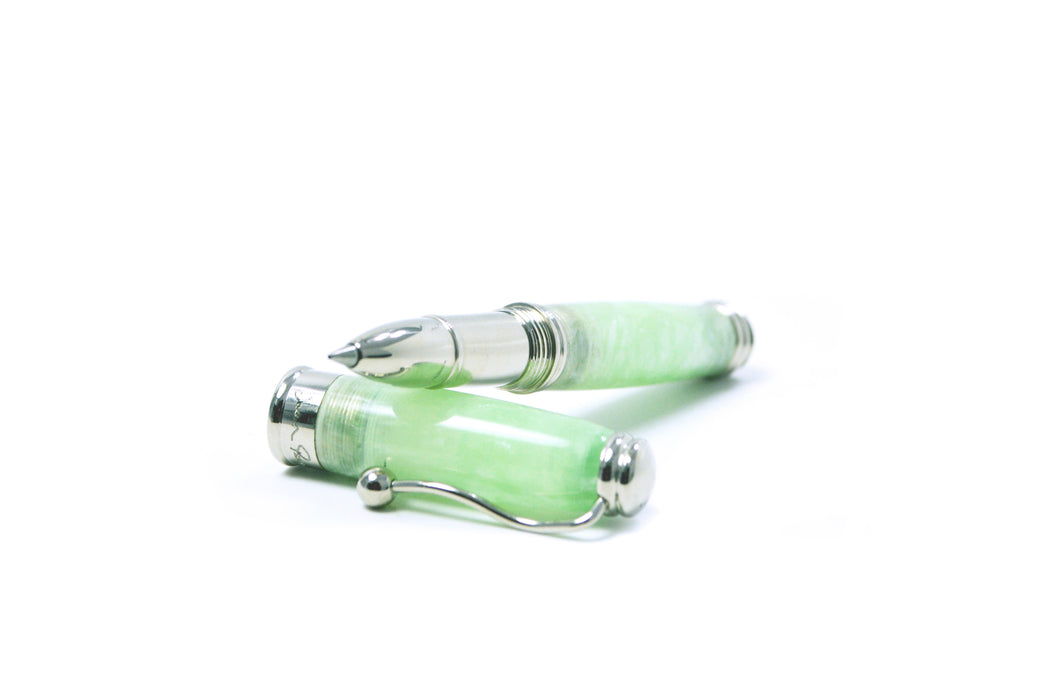 Jean-Pierre Lepine Indigo Classic Murano rollerball pen with green tea-colored ink and decorative glass design.
