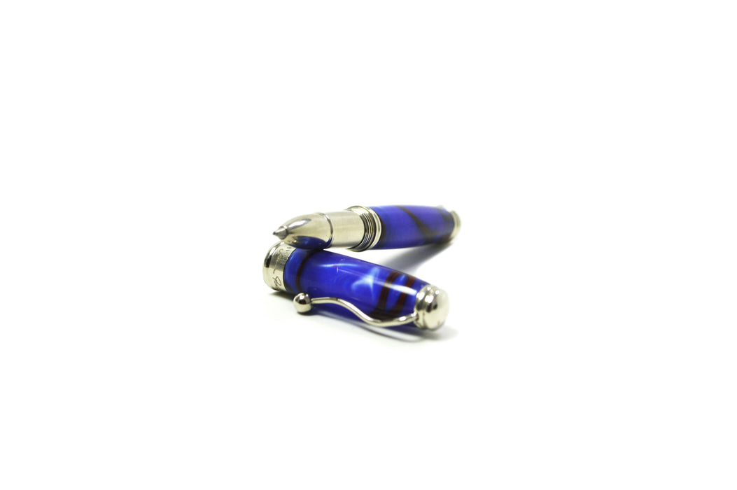 Jean-Pierre Lepine Indigo Classic Murano rollerball pen with blue body and red filet detail, showcasing elegant design and craftsmanship.