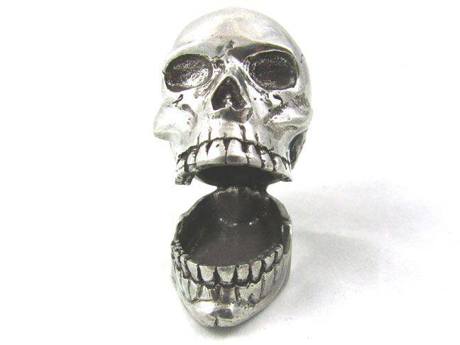 Jac Zagoory Laugh Out Loud Skull pen holder, a decorative skull-shaped pen rest with humorous design for desk organization.