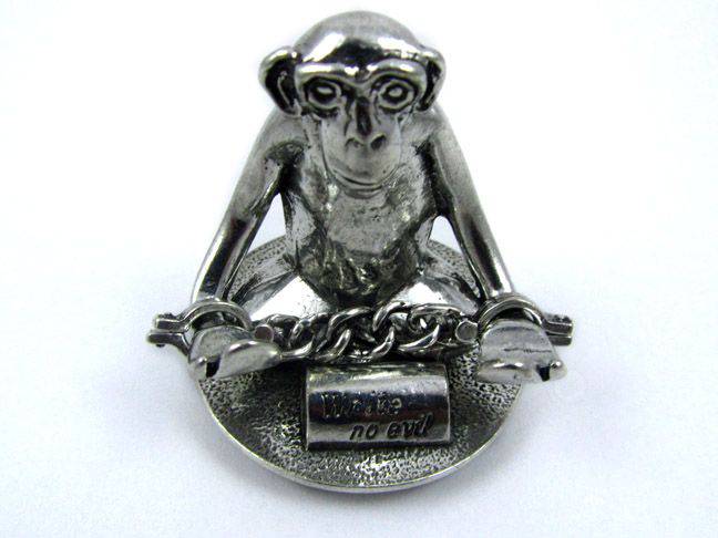 Jac Zagoory Write No Evil chained-down monkey hands mini pen holder with sculpted monkey hands as a decorative pen rest.