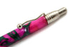 Jean-Pierre Lepine Indigo Classic Murano ballpoint pen with pink ink and green filet design, featuring a sleek, elegant appearance.
