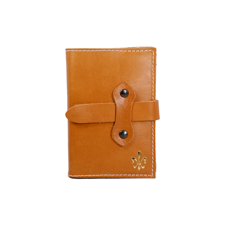 Medium orange Italian leather refillable latch journal with a classic cover, ideal for daily planning and note-taking.