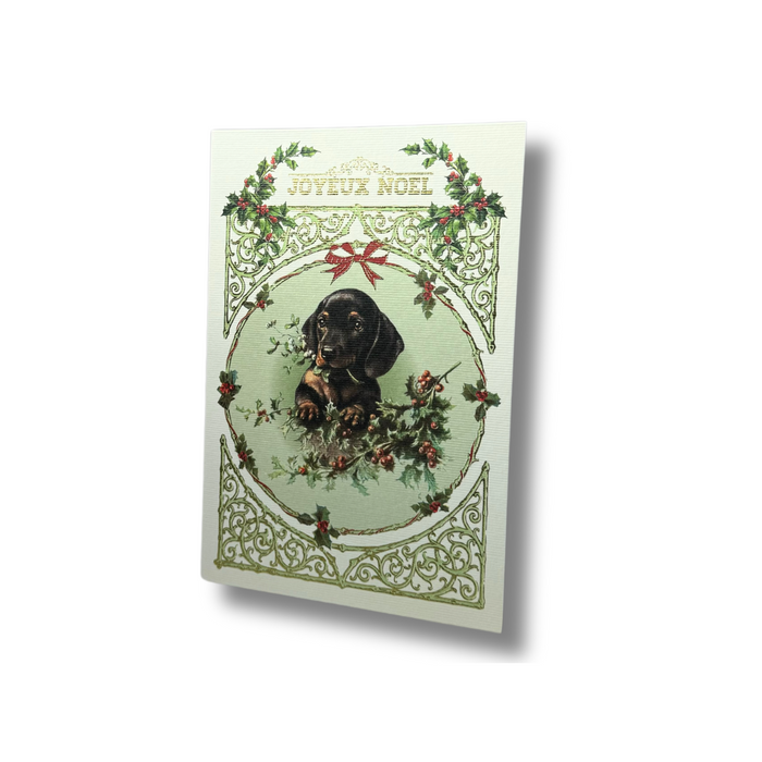 Rossi Christmas card featuring a festive puppy with "Joyeux Noel" greeting, holiday-themed design with cheerful colors and holiday motifs.